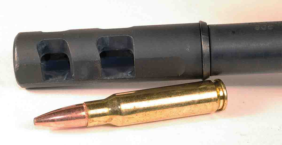 The rifle features a muzzle brake to reduce recoil and muzzle flip.